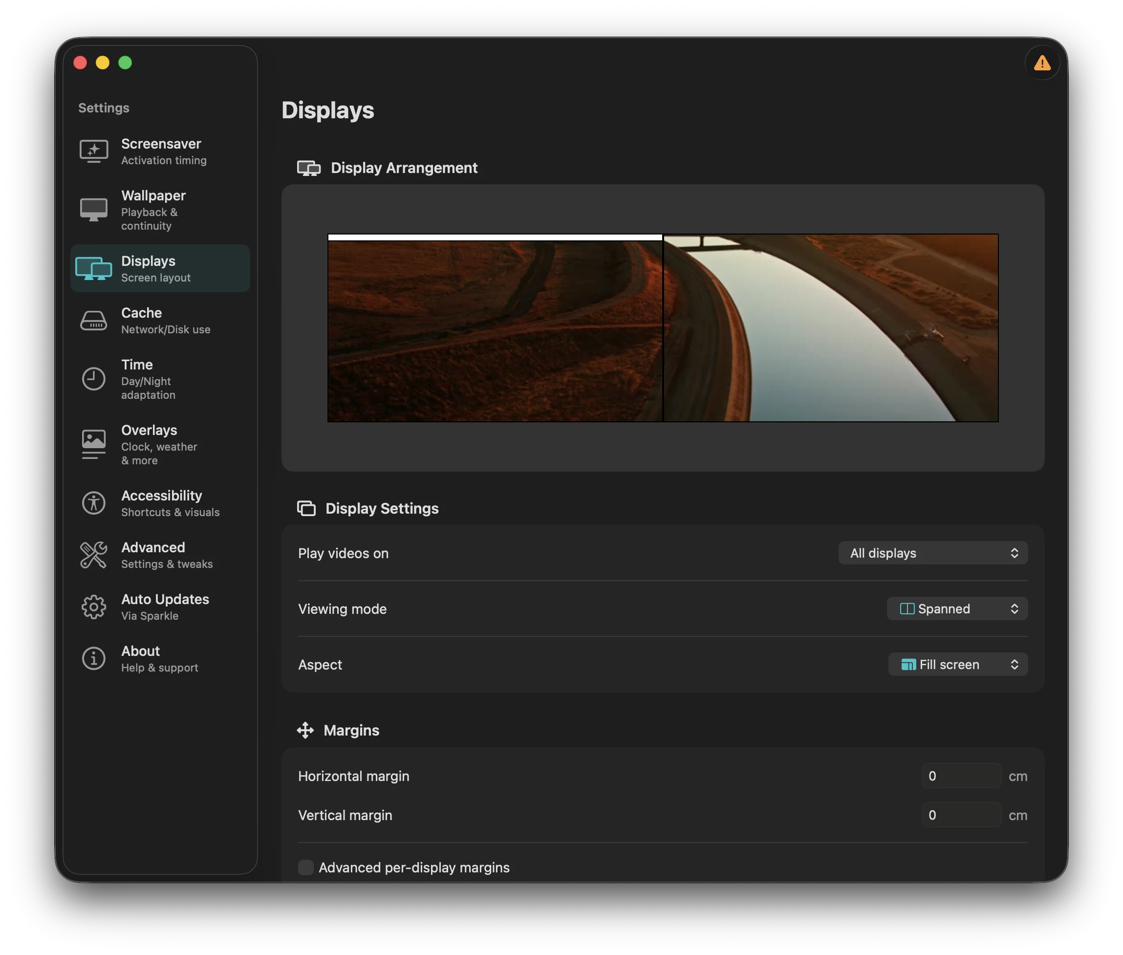 Aerial's Displays settings panel with a two-monitor arrangement preview showing a single video spanned across both screens, and Viewing mode set to Spanned with Fill screen aspect.