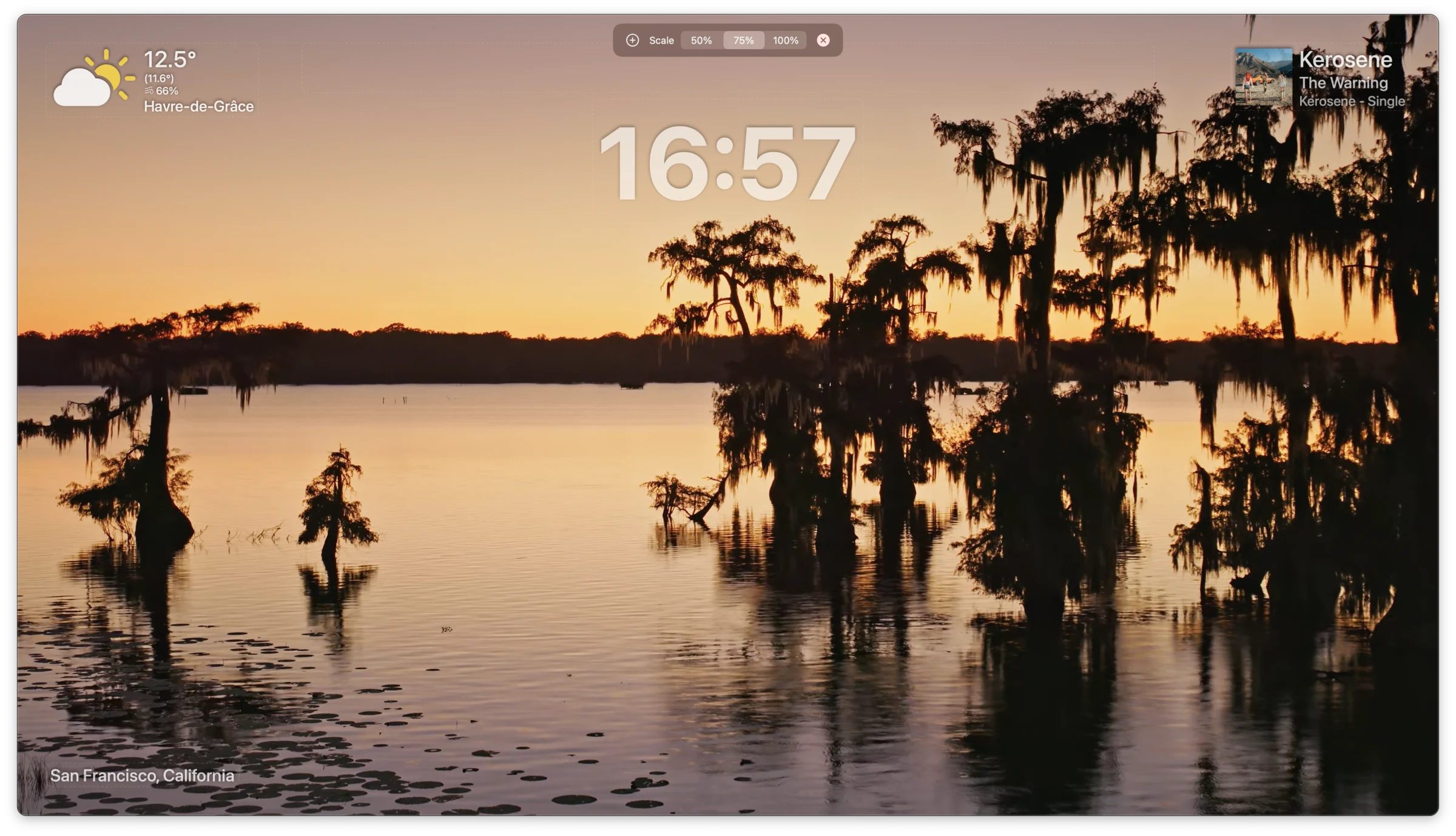 Aerial's overlay editor in live preview mode over a sunset video — weather widget top-left, a large center clock at 16:57, music now-playing top-right, and a San Francisco location caption bottom-left.