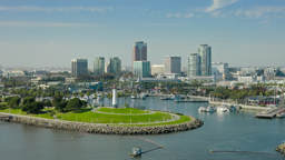 Sailboats dot the marina as Long Beach's gleaming skyline rises along the Southern California coast.
