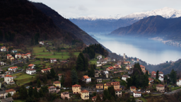 Terraced village homes spill down misty alpine slopes above the shimmering waters of Lake Como.